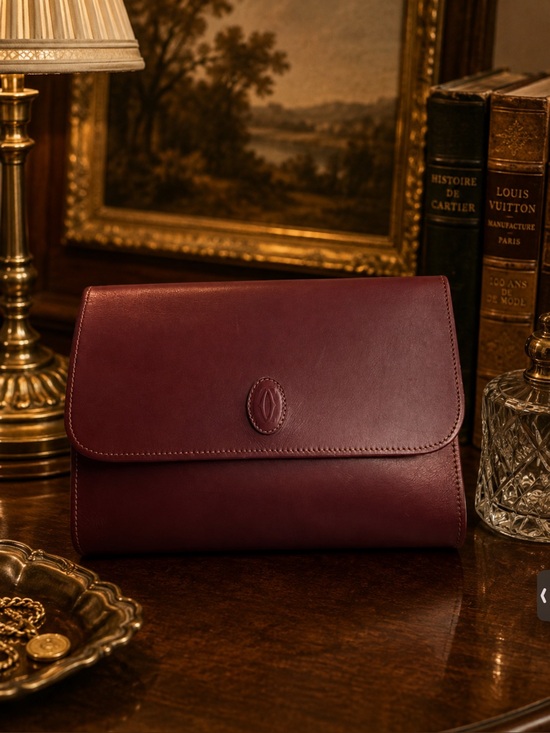 Cartier Handbags - Cartier Leather Clutch in burgundy